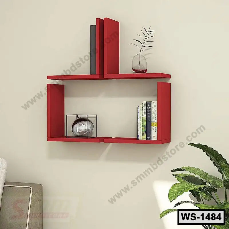 Modern red wooden wall shelf with books and decor in a living room setting