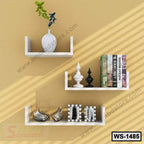 Modern white wall shelves on beige wall with decor items, books, and ornaments