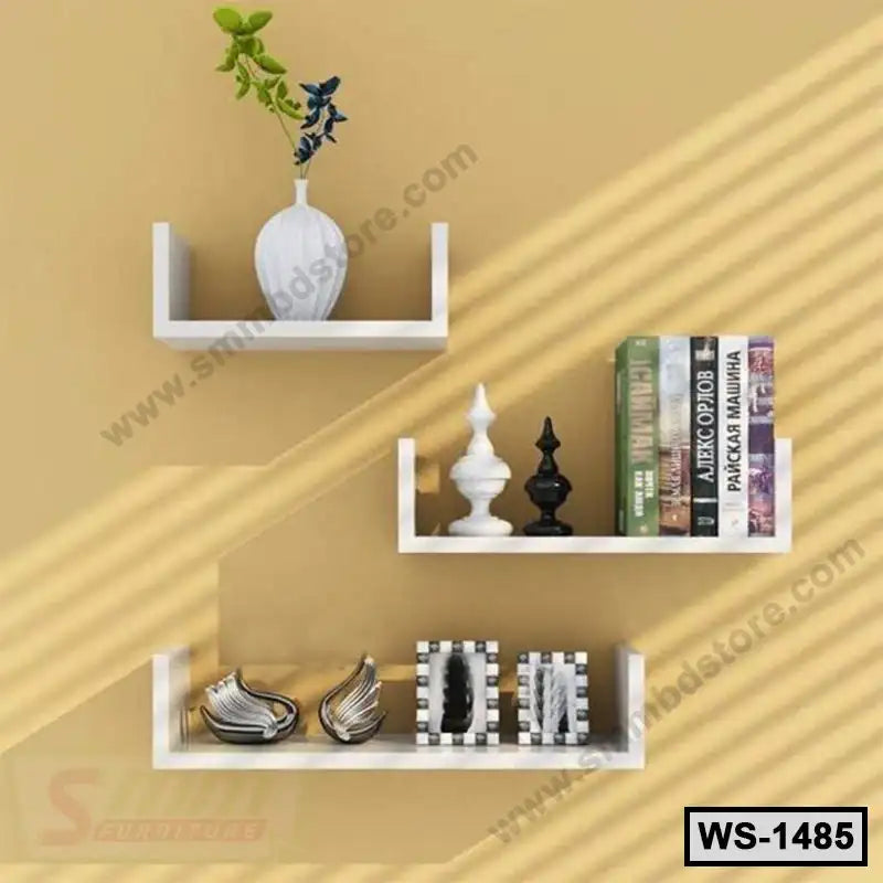 Modern white wall shelves on beige wall with decor items, books, and ornaments
