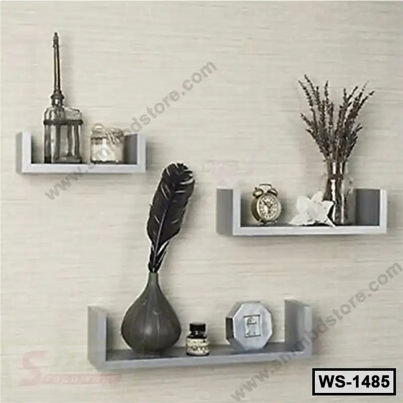 Modern wall-mounted floating shelves set with decorative vases, clock, and ornaments