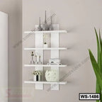 Modern white wall shelf with decorative vases, books, and plants in a minimalist room