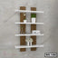 Modern wooden wall shelf with white floating shelves, decorated with plants and books.