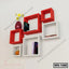 Modern wall shelf with red and white square compartments, books, vase, and decor items