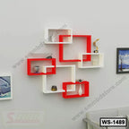 Modern red and white wall shelf set with decor items for home or office interior