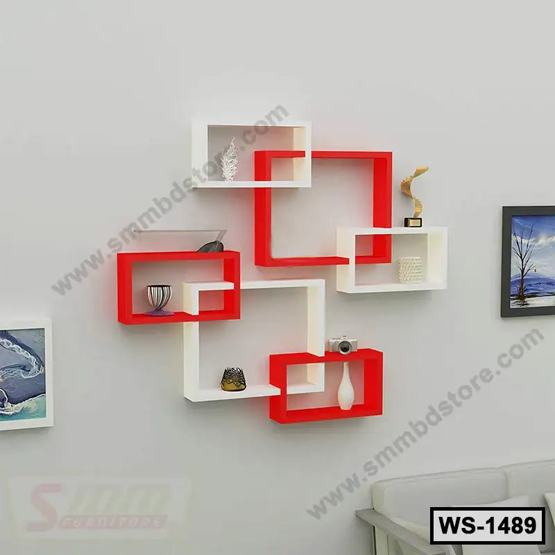 Modern red and white wall shelf set with decor items for home or office interior