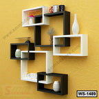 Modern black and white wall shelf with decorative items on yellow textured wall