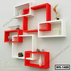 Modern red and white wall shelf with decorative items for home or office interior