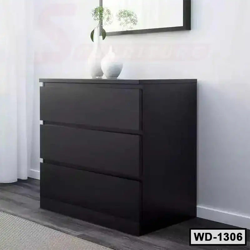 Modern black wooden wardrobe with three drawers in a minimalist bedroom setting Main image