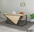 Modern executive office desk with black metal frame, wooden top, brown chair, and laptop