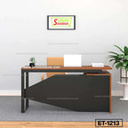 Modern office desk with laptop, chair, small plant, wall art, and indoor plant in minimal workspace.