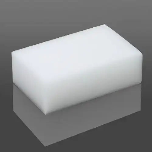 Rectangular high-density white PU foam block on a reflective gray surface