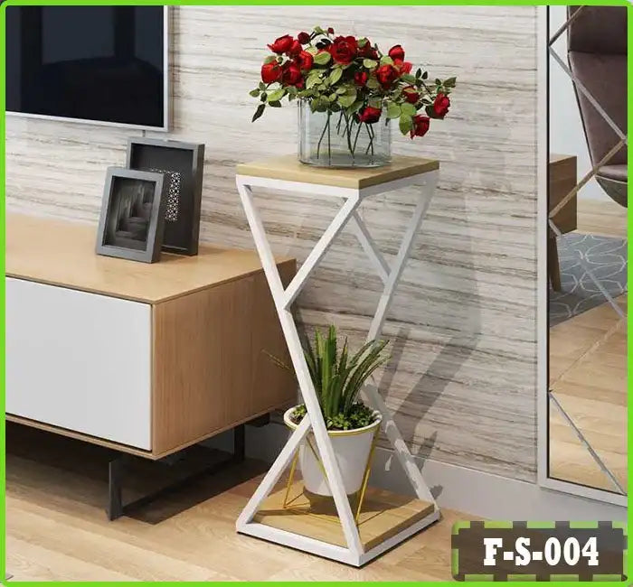 Modern white and wood plant stand with glass vase of red roses and green potted plant in living room Main image