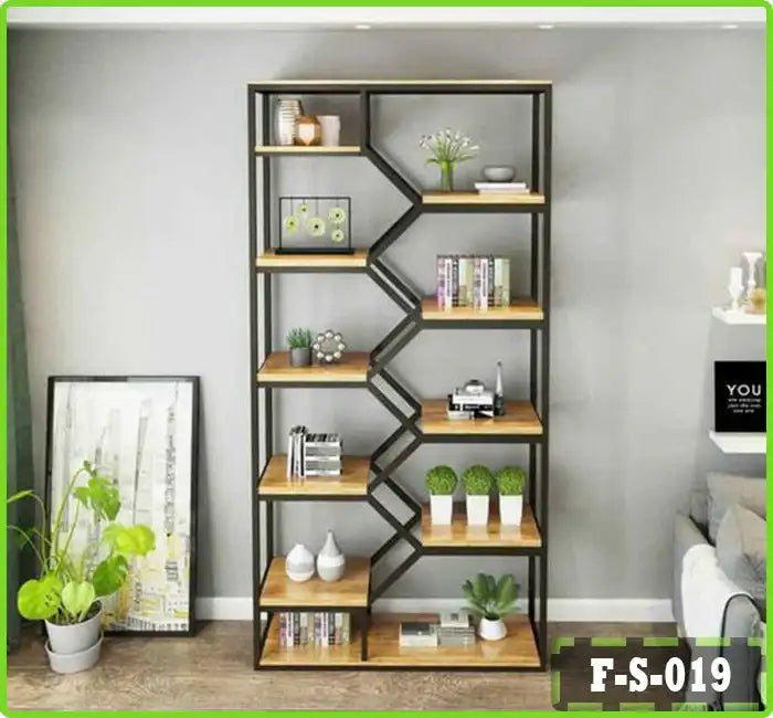 Modern black metal and wood bookshelf with geometric design, decorated with plants, books, and home decor items in a living room setting.
