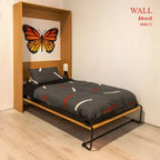 Modern wall bed with black bedding, wooden frame, butterfly wall art, and light wood floor